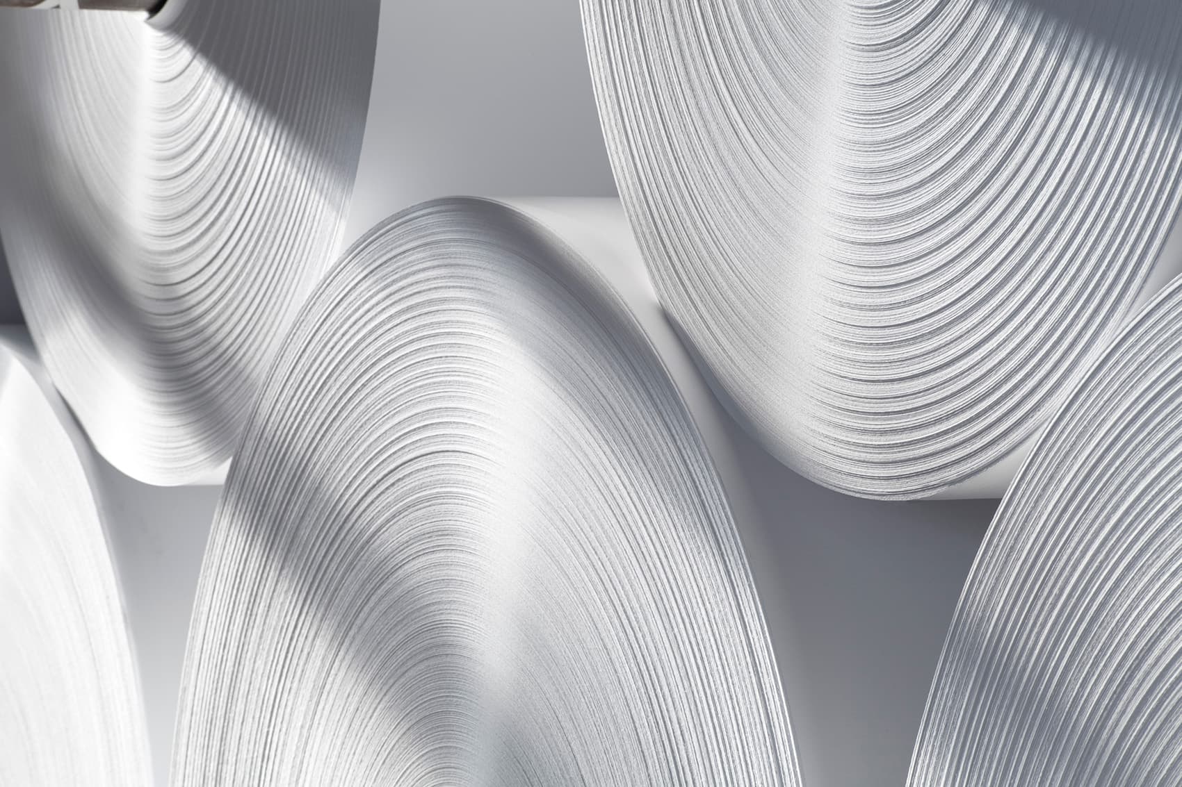 Nonwovens and industrial paper additives